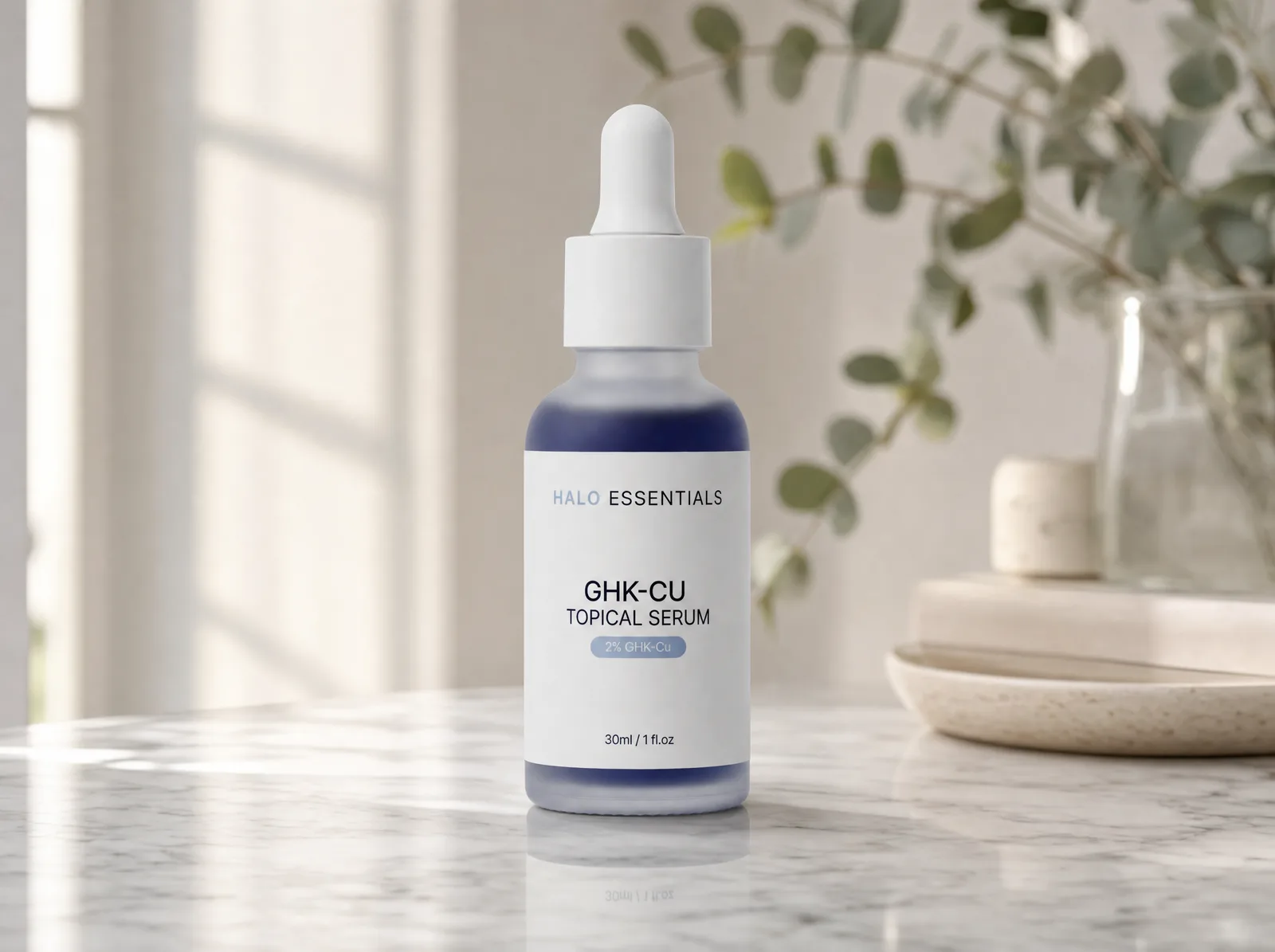 A Halo Essentials serum, the same product directed into a finished editorial frame on marble
